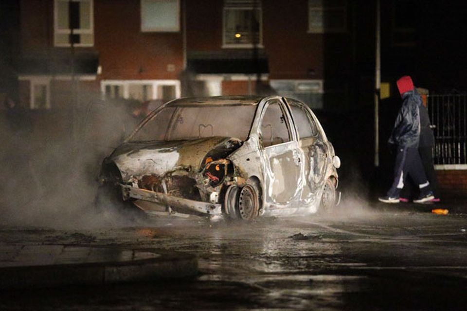 A car burns in the Castlereagh Street of east Belfast