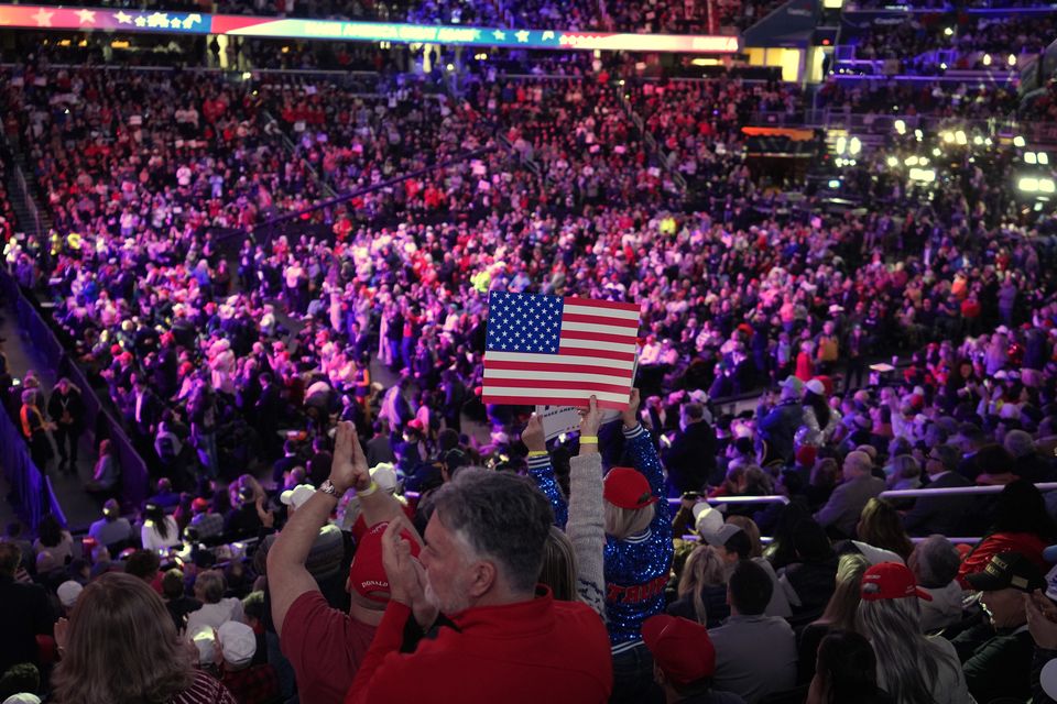 Attendees cheer before President-elect Donald Trump arrives at a rally ahead of the 60th presidential inauguration in Washington (Alex Brandon/AP)