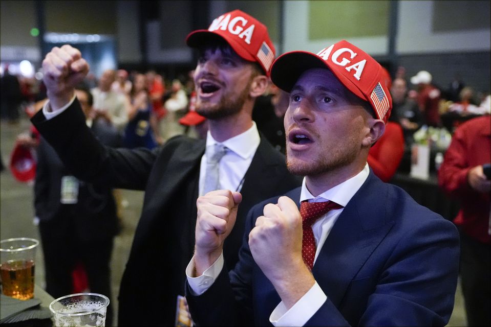 Donald Trump supporters have been cheering victories (Julia Demaree Nikhinson/AP)