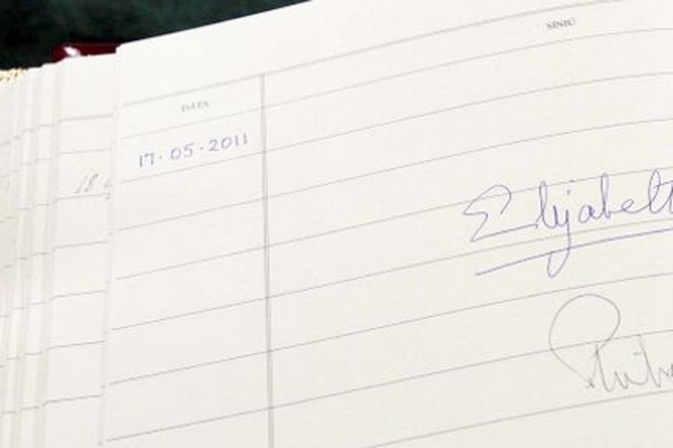 The signatures of Britain's Queen Elizabeth II and The Duke of Edinburgh are seen in the visitors book at Aras An Uachtarain in Phoenix Park, Dublin