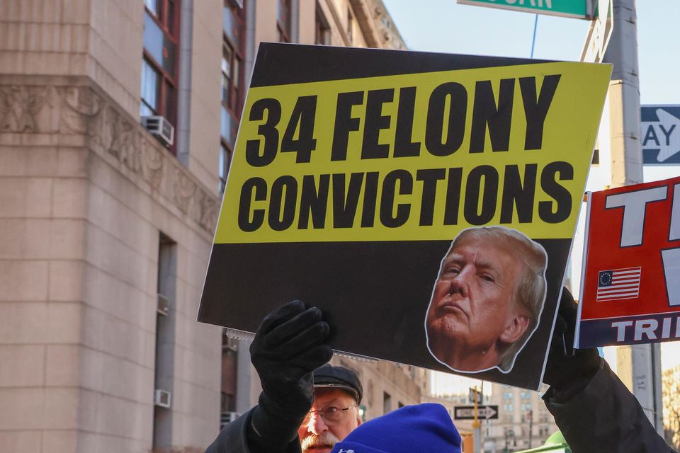 Demonstrators outside court before sentencing in Donald Trump’s hush money case (Yuki Iwamura/AP)