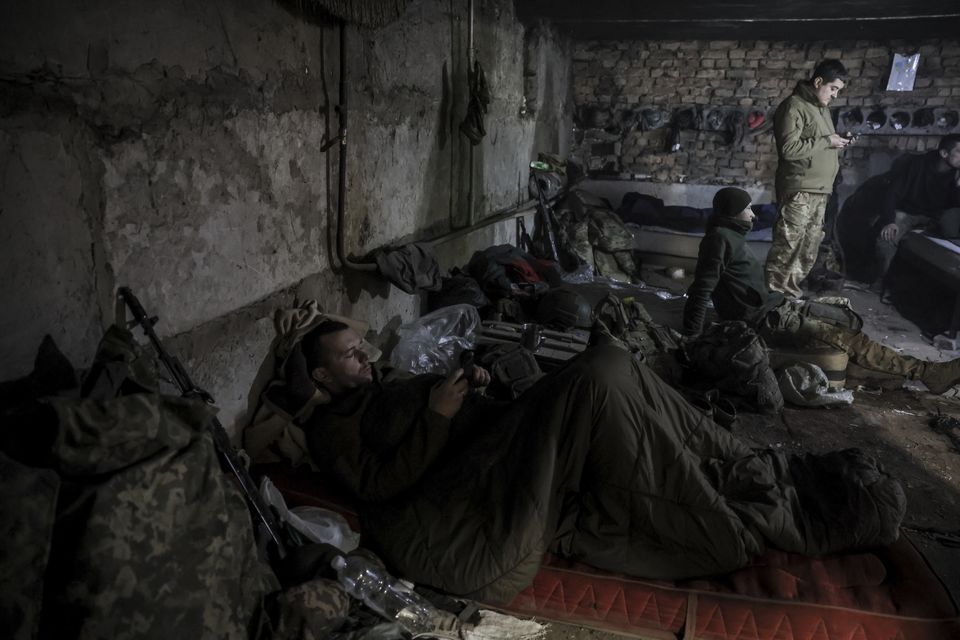 Servicemen have a short rest in a shelter on the front line near Chasiv Yar town in Ukraine’s Donetsk region (Ukraine 24th Mechanised Brigade via AP)