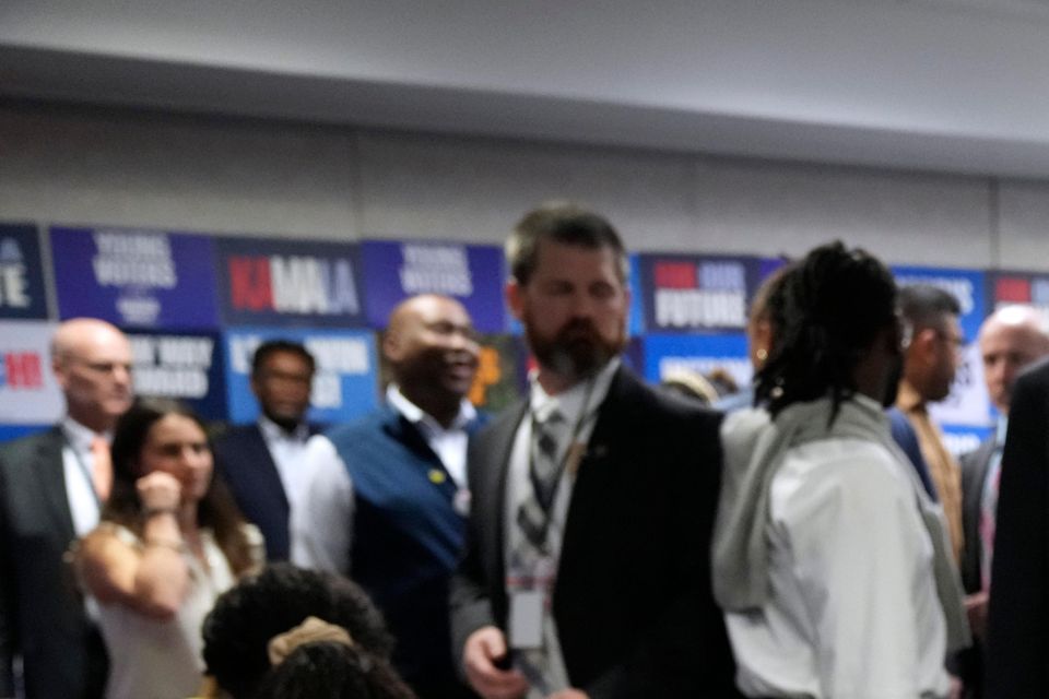 Democratic presidential nominee Kamala Harris, right, phone banks with volunteers at the DNC headquarters on Election Day in Washington (Jacquelyn Martin/AP)