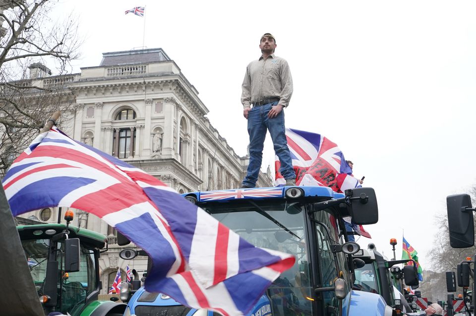 Farmers and their tractors protest in Whitehall (Gareth Fuller/PA)