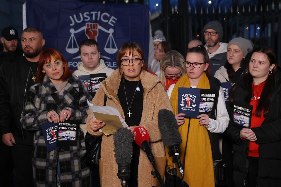 Toni Ogle-Johnston (centre), daughter of Ian Ogle, speaking outside Laganside Courts, Belfast (Liam McBurney/PA)