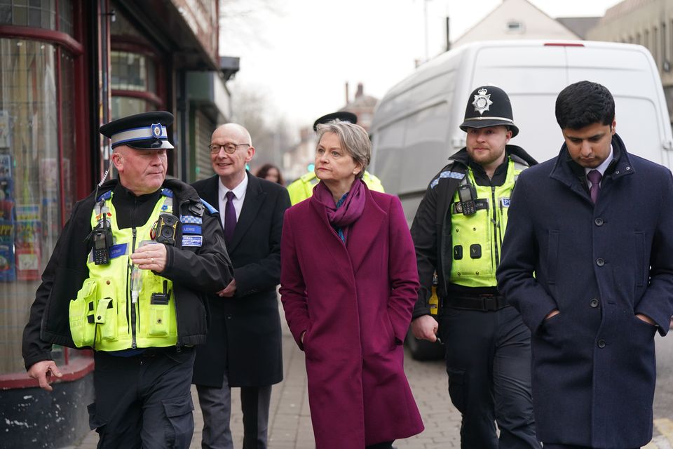 Home Secretary Yvette Cooper and Chancellor of the Duchy of Lancaster Pat McFadden with officers from West Midlands Police (Jacob King/PA)