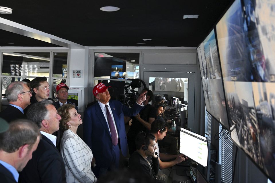 President-elect Donald Trump listens as Elon Musk explains the operations in the control room ahead of the launch (Brandon Bell/AP)