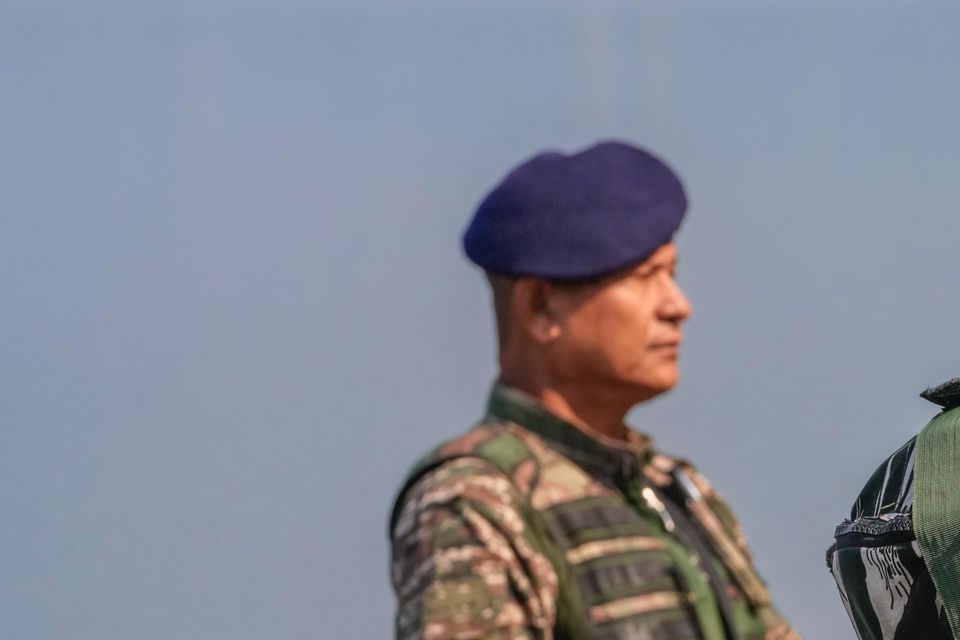 Paramilitary soldiers stand guard outside the venue of swearing in ceremony of ministers of Kashmir’s local government on the outskirts of Srinagar, Indian controlled Kashmir (Dar Yasin/AP)