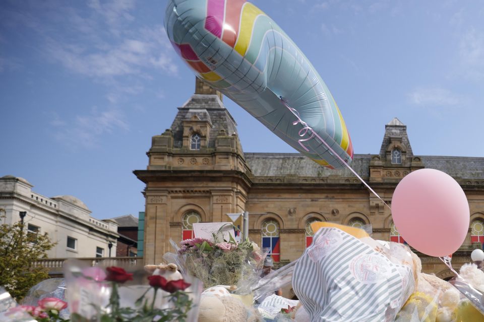 Flowers and tributes outside the Atkinson Art Centre Southport (James Speakman/PA)