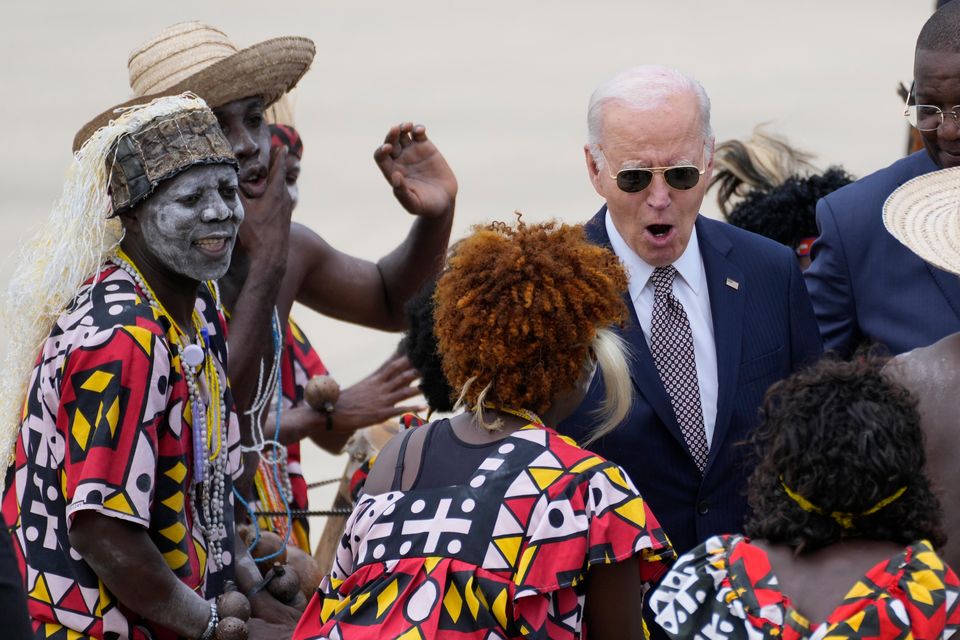 President Joe Biden watches a traditional dance after arriving at Catumbela airport in Angola (AP Photo/Ben Curtis)