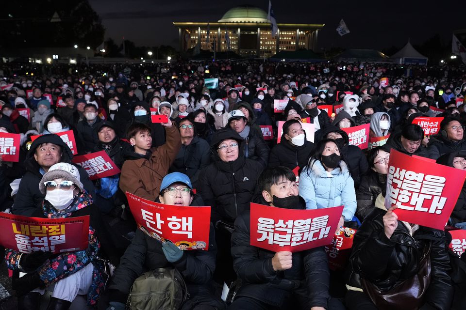 Protesters stage a rally in Seoul demanding South Korean President Yoon Suk Yeol’s impeachment following his short-lived martial law declaration (Ahn Young-joon/AP)