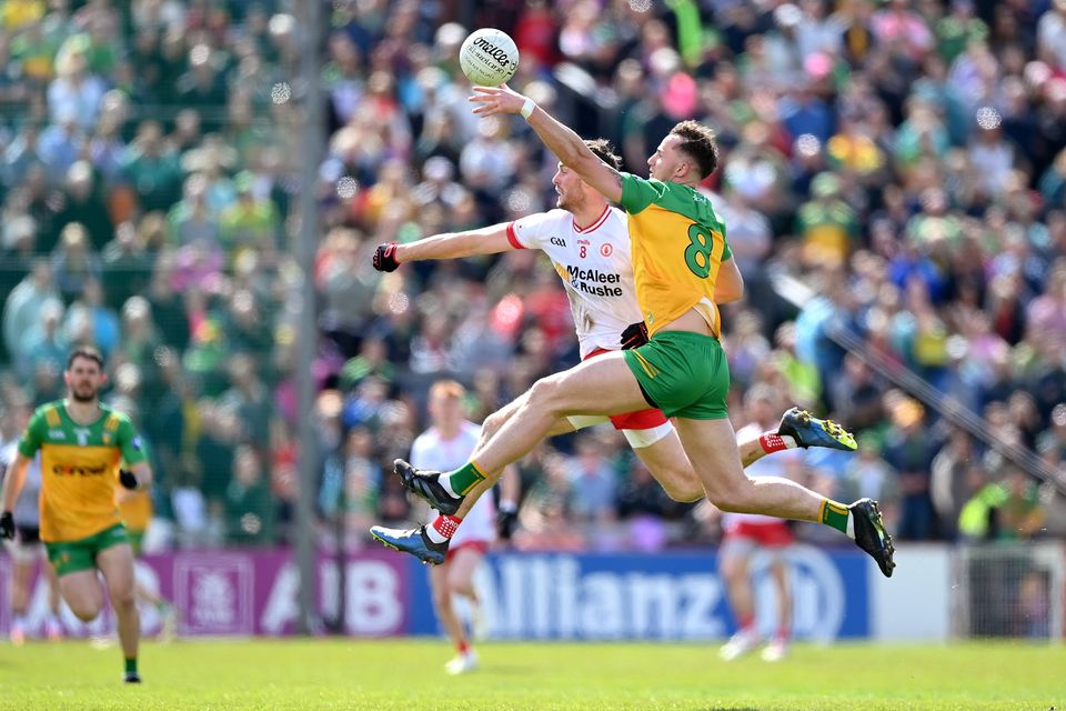 Jason McGee of Donegal in action against Brian Kennedy of Tyrone during the sides' Ulster SFC Semi-Final