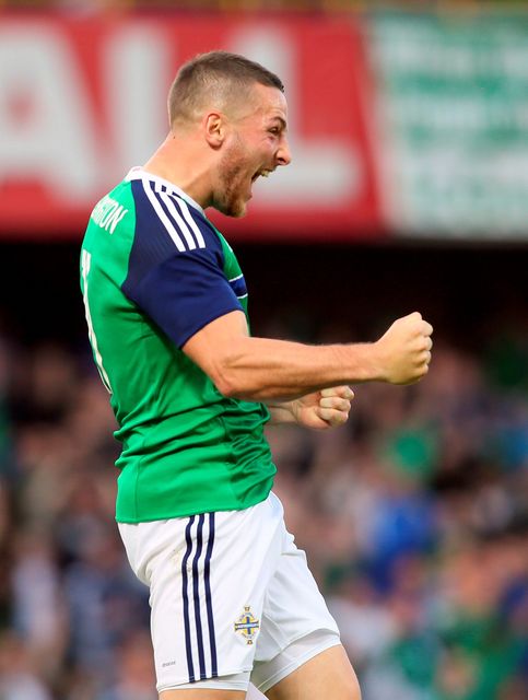 Northern Ireland's Conor Washington celebrates after scoring the team's second goal against Belarus during an international friendly football match between Northern Ireland and Belarus at Windsor Park in Belfast, Northern Ireland, on May 27, 2016. / AFP PHOTO / PAUL FAITHPAUL FAITH/AFP/Getty Images
