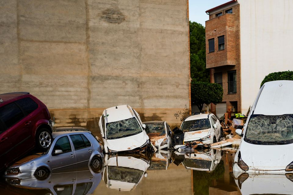 Flooded cars piled up in Valencia, Spain (Manu Fernandez/AP)