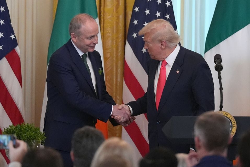 Taoiseach Micheal Martin and US President Donald Trump during the St Patrick’s Day reception (Niall Carson/PA)