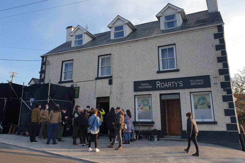 The crew outside Roarty's pub in the village