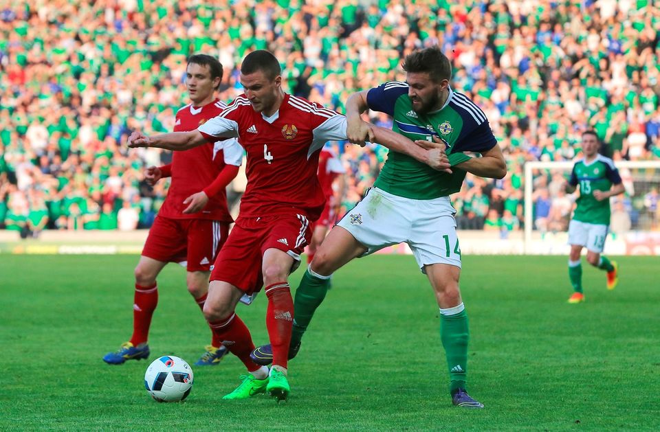 Belarus' Igor Shitov (left) and Northern Ireland's Stuart Dallas battle for the ball during the International Friendly at Windsor Park, Belfast. PRESS ASSOCIATION Photo. Picture date: Friday May 27, 2016. See PA story SOCCER N Ireland. Photo credit should read: Niall Carson/PA Wire. RESTRICTIONS: Editorial use only, No commercial use without prior permission, please contact PA Images for further information: Tel: +44 (0) 115 8447447.