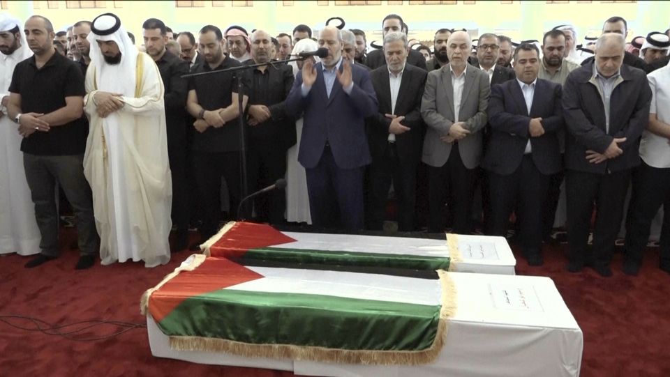 Khalil al-Hayya, centre, was among the senior officials attending the funeral in Doha, he is one of the two men seen as most likely to succeed as leader of Hamas (Qatar TV via AP)