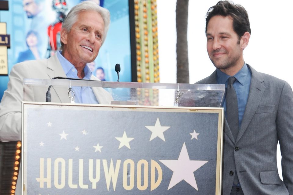 Michael Douglas, left, and Paul Rudd at a ceremony honouring Rudd with a star on the Hollywood Walk of Fame (Invision/AP)