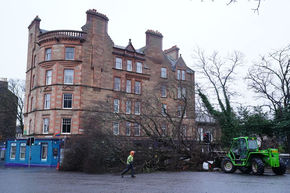 Workers removing a fallen tree on Regent Road, Edinburgh (Jane Barlow/PA)