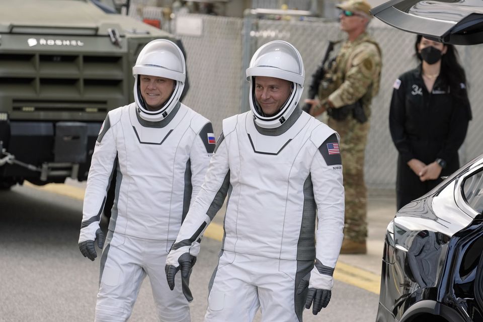 Nick Hague (right) and Aleksandr Gorbunov leave for their flight into space (Chris O’Meara/AP/PA)