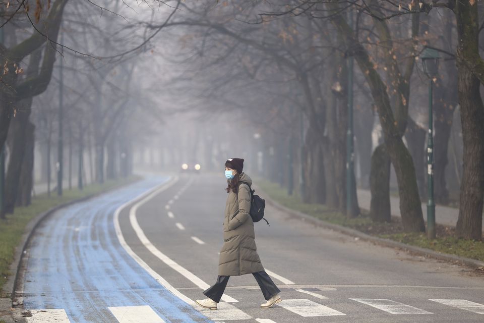 Many people could be seen wearing face masks for at least some protection (Armin Durgut/AP)