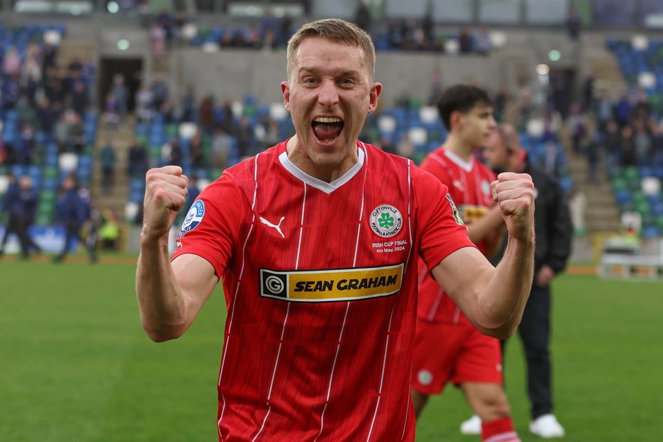 Addis celebrating Cliftonville's cup success on Saturday. Pic: Pacemaker Press