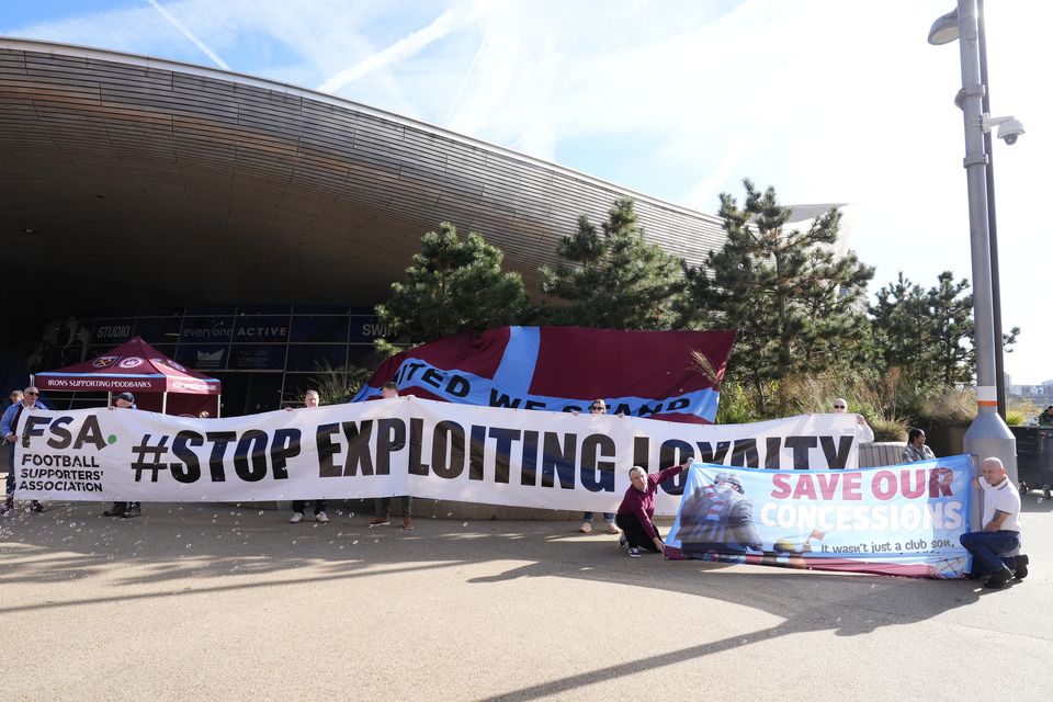 Fans hold up an FSA banner reading “Stop Exploiting Loyalty” outside the London Stadium ahead of the Premier League match between West Ham and Manchester United (Nick Potts/PA)