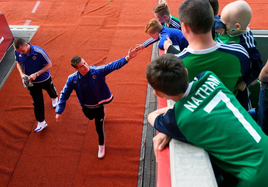 BELFAST, NORTHERN IRELAND - MAY 27: Northern Ireland's Paddy McNair high-fives some fans before the international friendly game between Northern Ireland and Belarus on May 26, 2016 in Belfast, Northern Ireland. (Photo by Charles McQuillan/Getty Images)