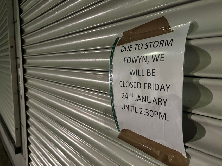 Preparations are under way in Donaghadee on the Co Down coast with sandbags at shop doors and signs up on shops ahead of Storm Eowyn (Rebecca Black/PA)