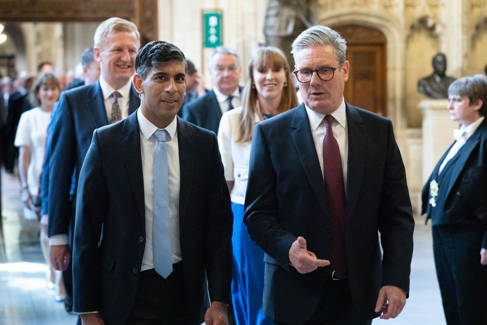 Prime Minister Sir Keir Starmer and Leader of the Opposition Rishi Sunak walk through the Member’s Lobby of the Houses of Parliament to the House of Lords to hear the King’s Speech (Stefan Rousseau/PA)