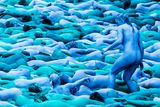 thumbnail: People take part in an installation titled Sea of Hull by artist Spencer Tunick in Hull. PA