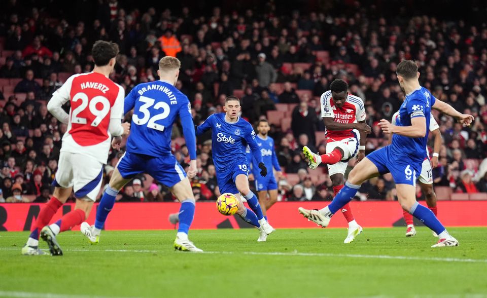 Bukayo Saka shoots towards goal under pressure (John Walton/PA)