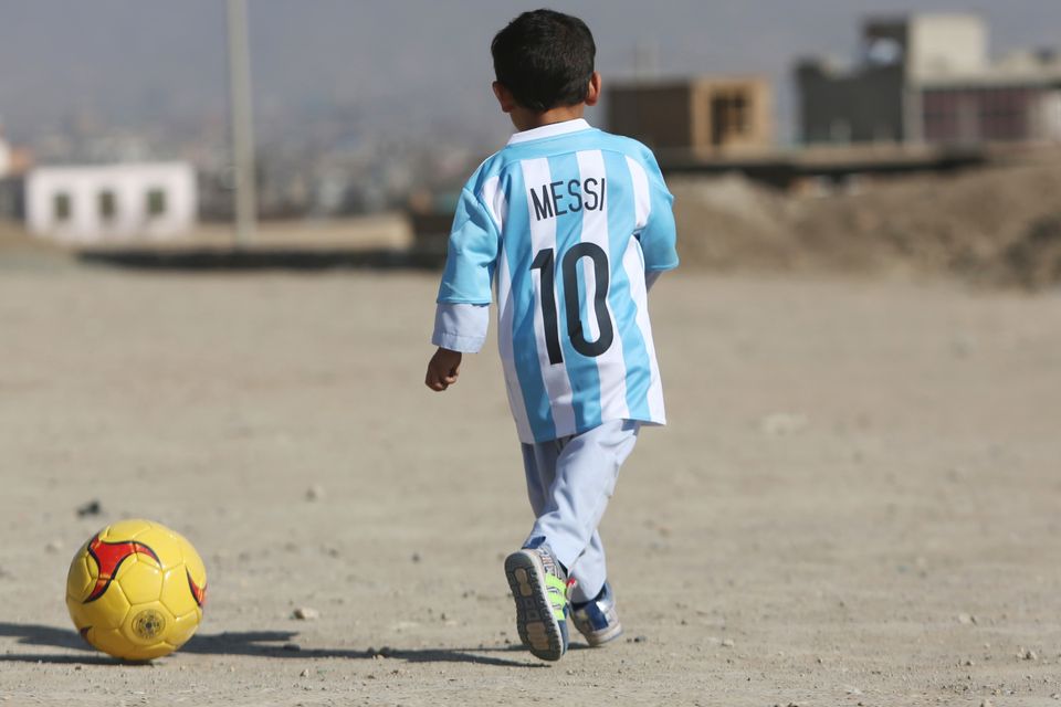 Five-year-old Murtaza Ahmadi pictured wearing homemade 'Messi 10