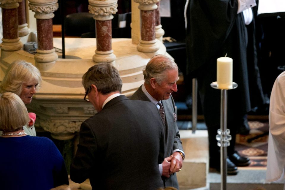 The Prince of Wales (centre) and the Duchess of Cornwall (left) attends a peace and reconciliation prayer service at St. Columba's Church in Drumcliffe on day two of a four day visit to Ireland. PRESS ASSOCIATION Photo. Picture date: Wednesday May 20, 2015. See PA story ROYAL Ireland. Photo credit should read: Colm Mahady/PA Wire