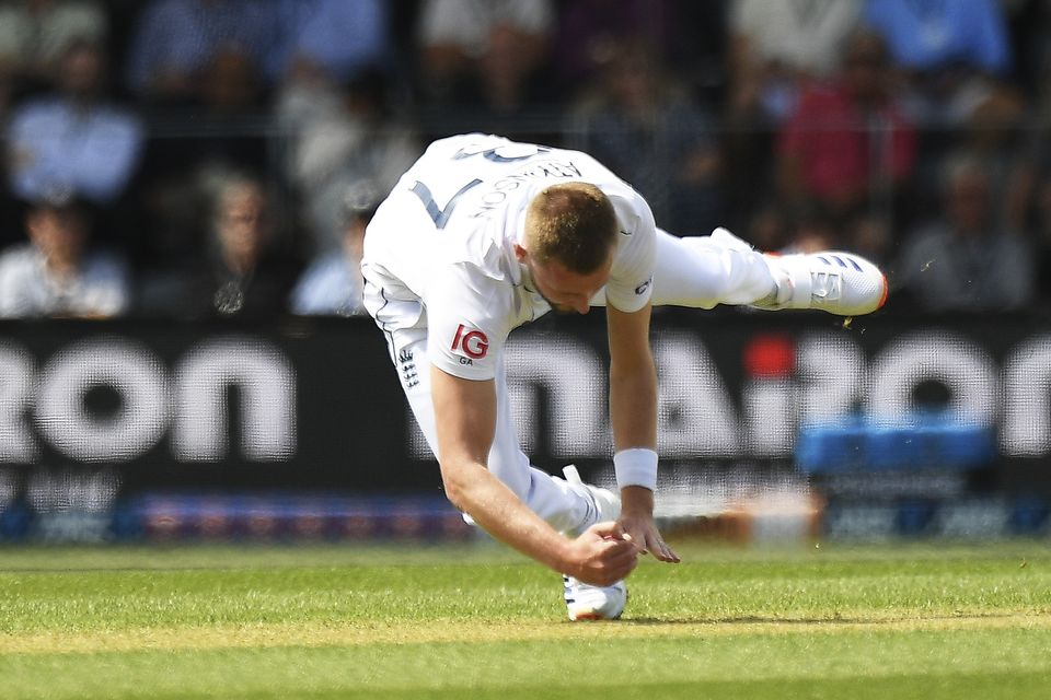 England’s Gus Atkinson takes a catch off his own bowling to dismiss New Zealand’s Devon Conway (Chris Symes/Photosport/AP)