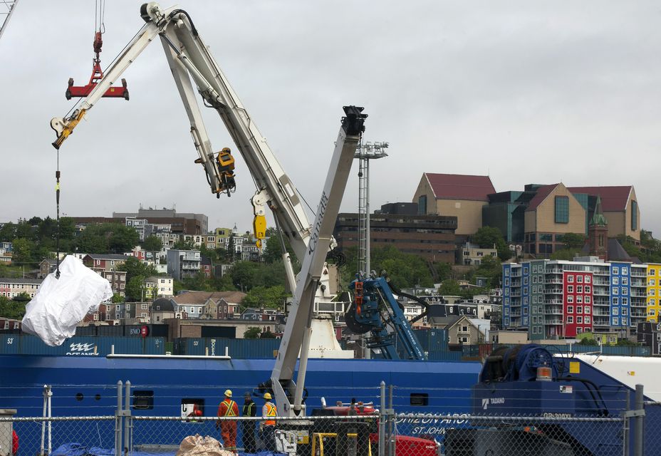 Debris from the Titan sub recovered from the ocean floor is unloaded from the Horizon Arctic at the Canadian Coast Guard pier in St John’s, Newfoundland (Paul Daly/AP)