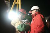 thumbnail: SAN JOSE MINE, CHILE - OCTOBER 12: (NO SALES, NO ARCHIVE) In this handout from the Chilean government, Mario Sepulveda, 39, the second miner to exit the rescue capsule, shakes hands with Chilean President Sebastian Pinera (R) October 12, 2010 at the San Jose mine near Copiapo, Chile. The rescue operation has begun bringing up the 33 miners, 69 days after the August 5th collapse that trapped them half a mile underground. (Photo by Hugo Infante/Chilean Government via Getty Images)