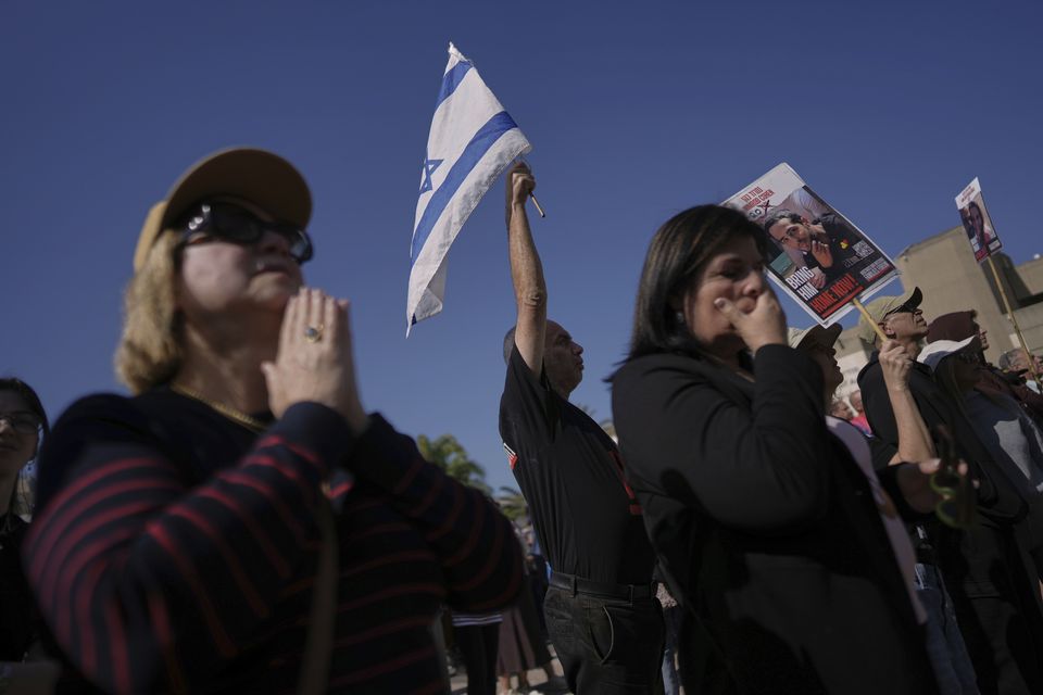 The three men have now crossed the border back to Israel (AP)