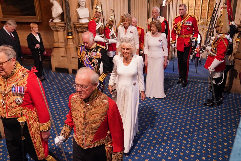 The King and Queen, followed by the Marchioness of Lansdowne and Lady Sarah Keswick, arrive for the State Opening of Parliament (Jonathan Brady/PA)