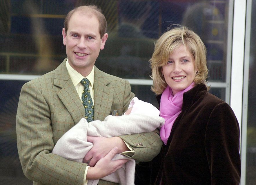 Edward, holding his baby daughter in his arms, and Sophie leave Frimley Park Hospital in Surrey in 2003 (Johnny Green/PA)