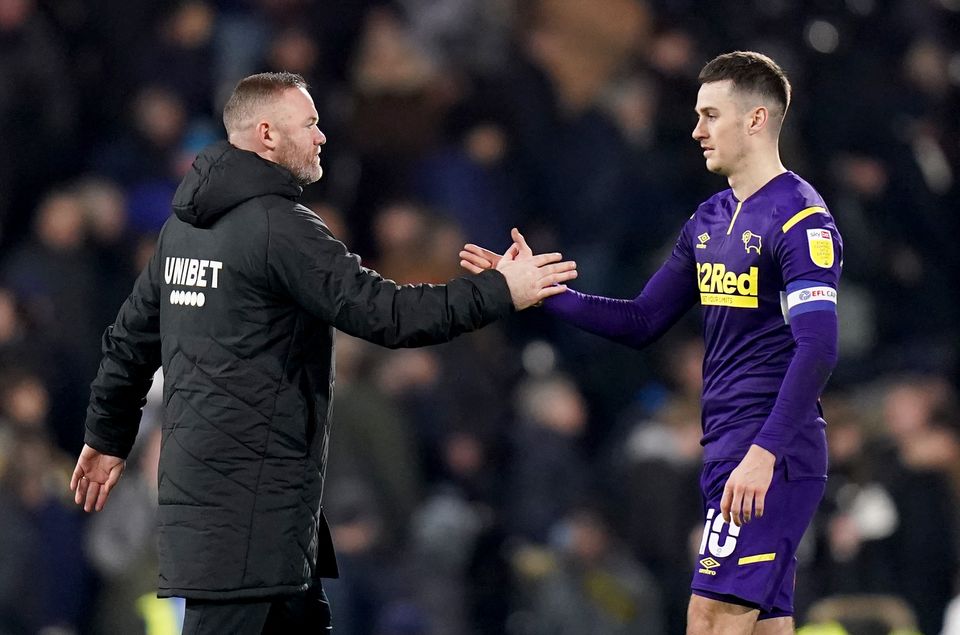 Tom Lawrence’s former Derby manager Wayne Rooney (left) had claimed the player was overlooked by Wales because of a “bit of history” with the former manager Rob Page (Adam Davy/PA)