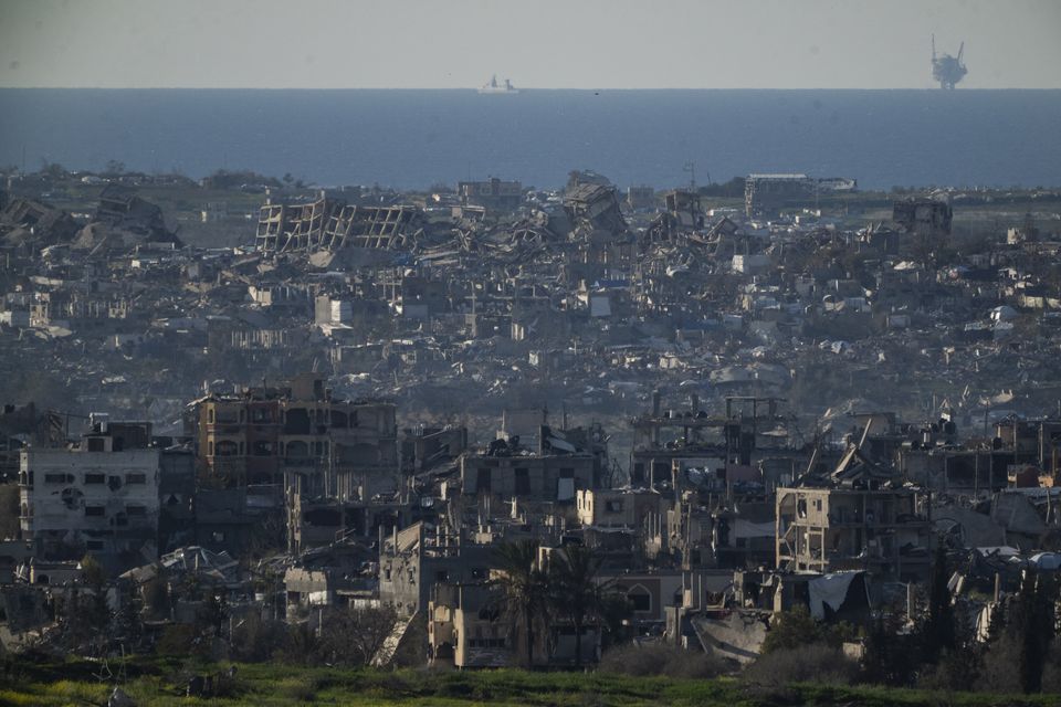 Buildings destroyed during the Israeli air and ground offensive stand in the Gaza Strip are seen from southern Israel (Leo Correa/AP)