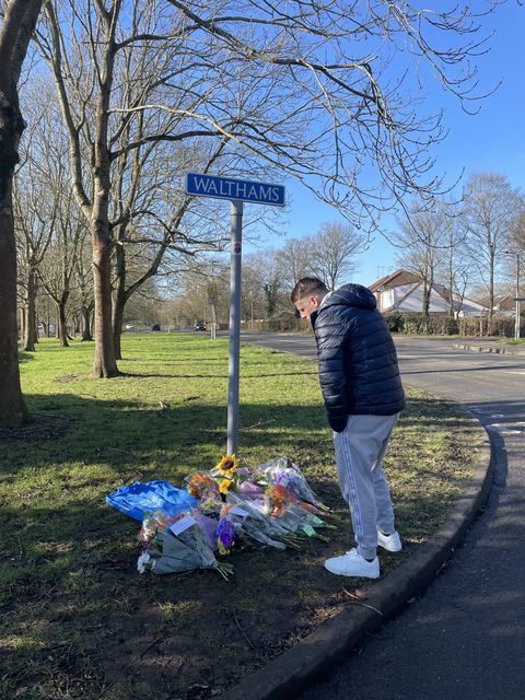 Members of the community pay tribute near the scene of a collision where two children died in Pitsea, Essex (Rosie Shead/PA)