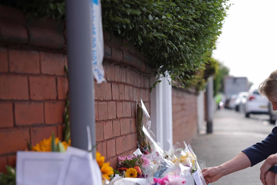 Home Secretary Yvette Cooper looks at tributes near where three young girls were killed in Southport (James Speakman/PA)