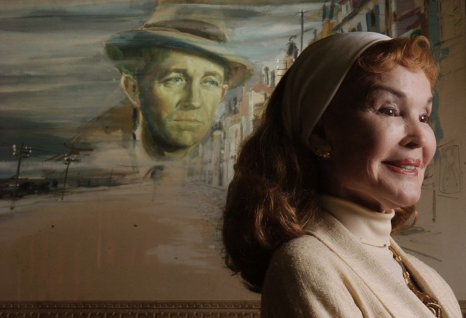 Kathryn Crosby in front of the original movie poster from Bing Crosby’s 1953 film Little Boy Lost (Marcio Jose Sanchez/AP)