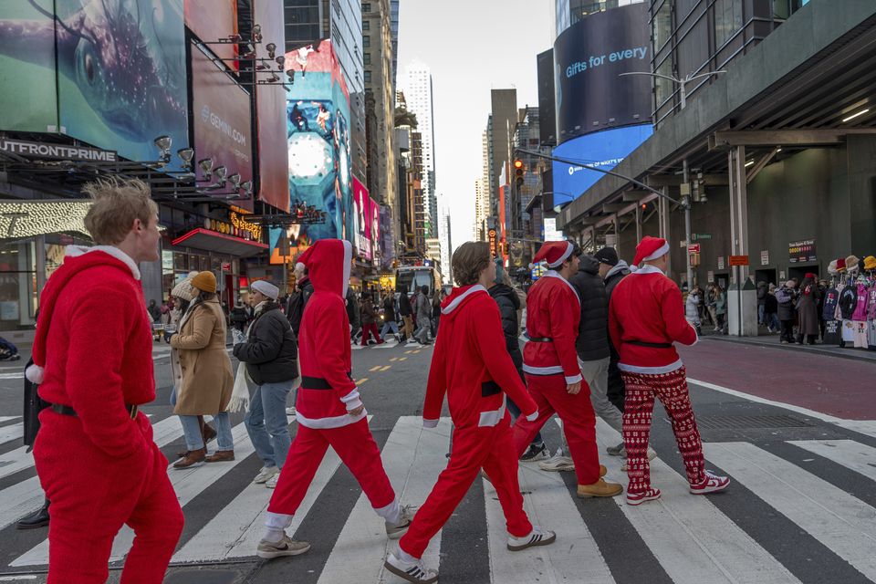 Revellers in New York (Julia Demaree Nikhinson/AP)