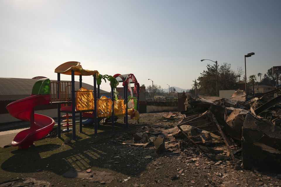 The disaster has destroyed entire homes with flames hitting churches, schools, a synagogue, libraries, bars and playgrounds (Jae C Hong/AP)