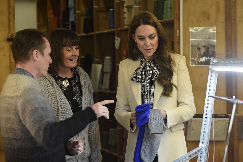 The Princess of Wales meets members of the production team during a visit to Corgi, a textiles manufacturer in Ammanford, South Wales (Rebecca Naden/PA)