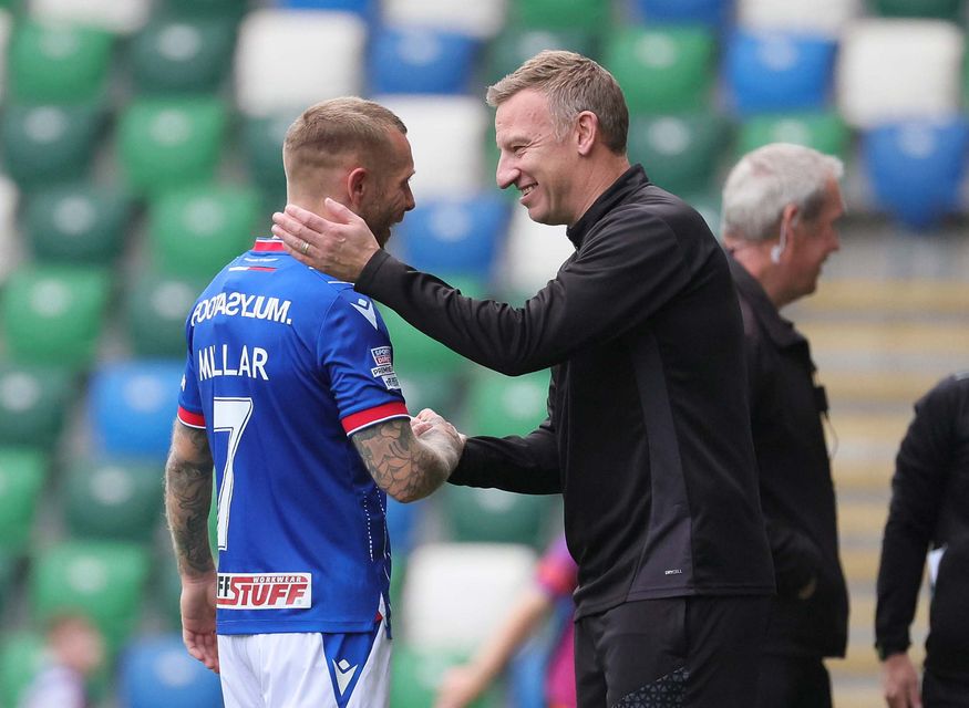 Carrick Rangers manager Stuart King congratulates Linfield's Kirk Millar after the forward's late winner